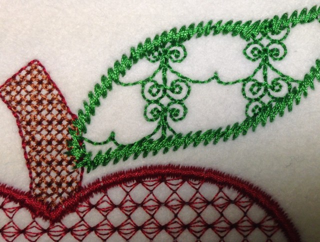 Notice that I changed the stalk fill to tiny little cross stitches and added a stem stitch outline on the leaf instead of the satin outline.