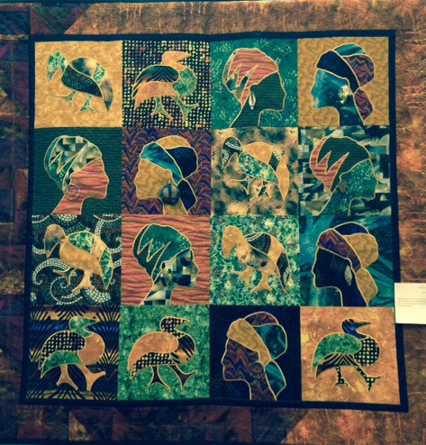 Of course I was drawn to this quilt : "The Beauty of Africa" by Laurie Turik which was the result of a class taken many years ago with Liz Faminoff and finally completed.The rick colours add excitement and the large earrings add sparkle to the wall hanging